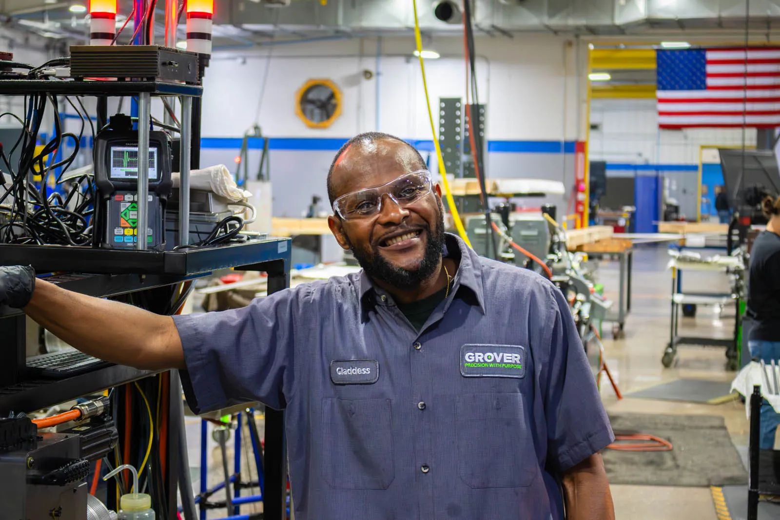 Grover Precision team members working together on the manufacturing shop floor